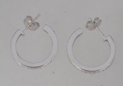 A pair of 925 Art Deco style silver earrings with channel set CZ with post backs.