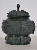 A 20th century Chinese bronze lidded censor bowl. Measures: 10cms high.