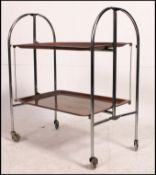 A 1970's retro chrome and faux bakelite folding drinks / hostess trolley with chrome frame,