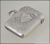 A late Victorian silver hallmarked vesta case with rococo chase decoration by Minshull & Latimer,