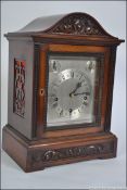 An English mahogany cased topped bracket clock.