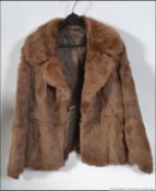 A good example of a light chestnut rabbit? fur short jacket ,