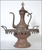 A 19th / 20th century copper Turkish coffee pot adorned with applied decoration having a star