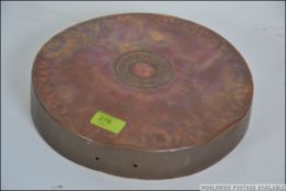 An Arabic inscribed copper wall charger - mount with central character marks regarding