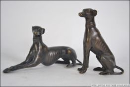 A pair of bronze grey hounds, Dog and Bitch,