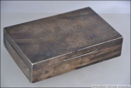 A silver hallmarked table top cigarette box by Walker & Hall bearing Sheffield date marks for 1957.