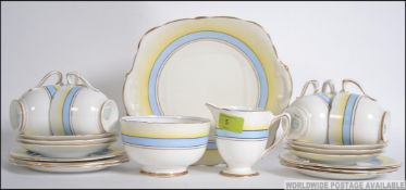 A bone china Royal Stafford tea service consisting of six cups, six saucers, six side plates,