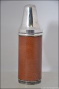 A good leather and silver plated hunting flask.