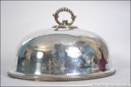 A fabulous large heavy silver Sheffield plate meat cover having plain armorial cartouch with handle