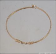 A 9ct gold and diamond ladies bangle / bracelet being hallmarked for London 1978.