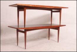 A pair olf 1960's teak wood Gordon Russell rectangular coffee / occasional tables raised on tapered