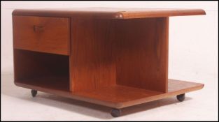 A good 1970's Danish Pandora's box type teak wood coffee table of square form,