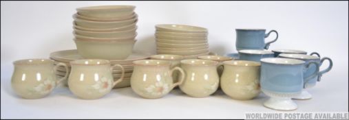 A part dinner and tea service by Denby to include dinner plates, side plates, cups,