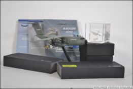 A collection of Airbus related memorabilia to include 2 cased pens, an Airbus glass paperweight,