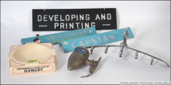 A vintage Woodbine and Capstan smoking advertising plastic signs together with an Austin motoring