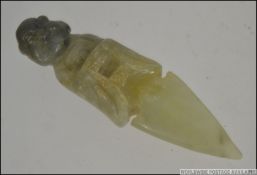 A 19th / 20th century carved Jade dagger / nail cleaner ? of a smiling Buddha above a pointed blade.