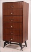 A 1960's retro rosewood Meredew tall pedestal chest of drawers raised on ebonised suspension set