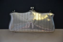 A silver hallmarked engine turned evening purse,