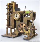 A vintage early 20th century electro magnetic master clock movement constructed of brass with small