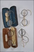 A collection of four early 20th century vintage reading glasses to include tortoiseshell frames,