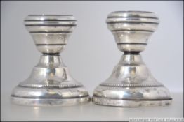 A pair of silver hallmarked stub candlesticks believed to be by Marson & Jones. Birmingham 1927.