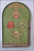 A vintage Lindstrom's 1930's Steeplechase bagatelle / pinball board game being of tinplate and wood