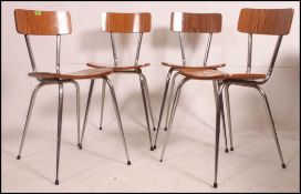 A set of 4 vintage 1970's retro Tavo Belgian dinette chairs raised on tubular metal supports with