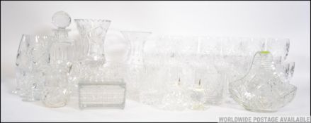 An extensive collection of cut glass crystal to include decanters, wine glasses, vases etc.
