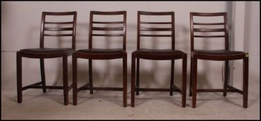 A set of four vintage CC stamped bombed out Britain ladder back dining chairs with drop in seat
