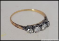 A vintage 18ct gold and 5 stone diamond ring.