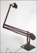 A Hadrill & Horstmann vintage early 20th century anglepoise lamp with squared base,