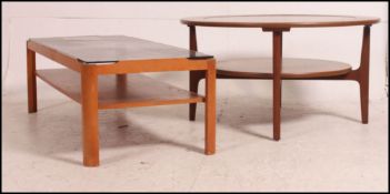 A 1970's retro Myer teak and smoked glass coffee table of rectangular form together with a circular