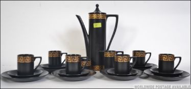 A retro 20th century Portmeirion tea / coffee service in a decorative design having cups, saucers,