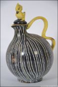 1950`s Goebels black ground body with yellow and white stripes glazed jug with yellow shaped handle