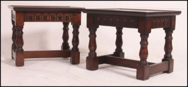 A pair of mid century solid oak coffin table stools.