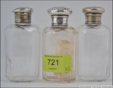 2 silver hallmarked lidded glass ladies dressing table vanity bottles together with another white