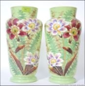 Pair of Victorian opaque glass baluster form vases having enamel and hand painted decoration of