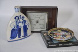 A vintage 20th century Bakelite cased barometer along with a Russian made blue and white vase and a