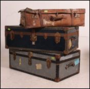 A good collection of three travel cases ,, 1 leather suitcase and two steamer trunks,