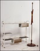 A retro 1960's teak wood standard lamp together with a metal plant stand,
