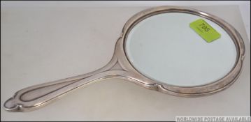 A silver hallmarked dressing table mirror by J Collyer Ltd, Birmingham 1947. Weight 424.