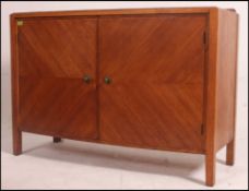 A retro mid 20th century bow front quarter veneer sideboard having two doors to the front opening