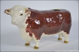 A Beswick figure of a Hereford Bull Ch of Champions having printed marks to the base.