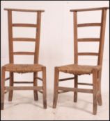 A pair of 19th century French beech wood and rattan weave prie dieu chairs raised on squared legs