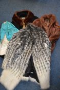 A collection of ladies clothing to include rabbit furs,