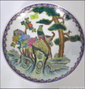 A 20th cenutry Chinese famille rose charger with blue geometric borders having handpainted