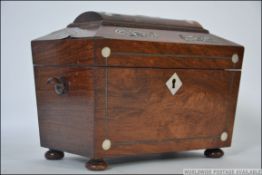 A Regency rosewood tea caddy, early 19th century, of sarcophagus form,