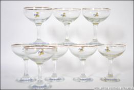 A collection of eight retro 1970's Babycham advertising glasses each applied Babycham logo to the