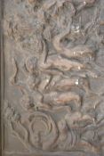 An unusual early 20th century cast metal wall plaque of rectangular form with classical scene cast