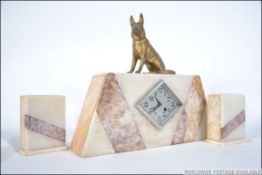 A 1930's French Art Deco marble clock garniture.